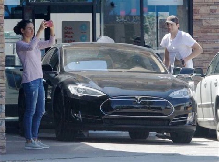 Ashton, Mila and Their Tesla