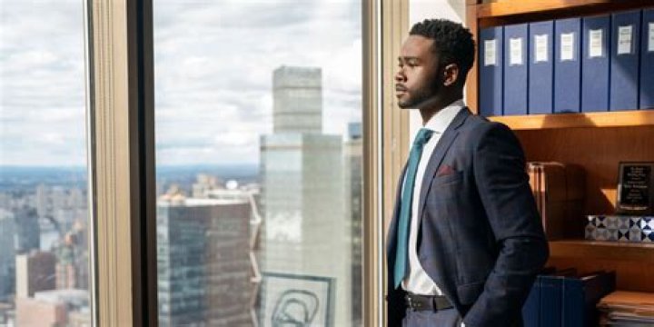 Bradley Gibson as Tyler Robinson, looking out a window while in his office and wearing a suit in episode 1 of Netflix series Partner Track Bradley Gibson as Tyler Robinson, looking out a window while in his office and wearing a suit in episode 1 of Netflix series Partner Track