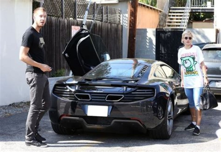 Calvin Harris With his McLaren 