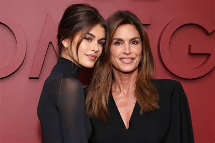 Cindy Crawford leaves her daughter Kaia's apartment in stylish plaid coat