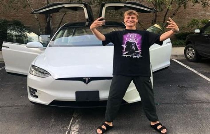 Cole With His Car (Source: Glamour Path)