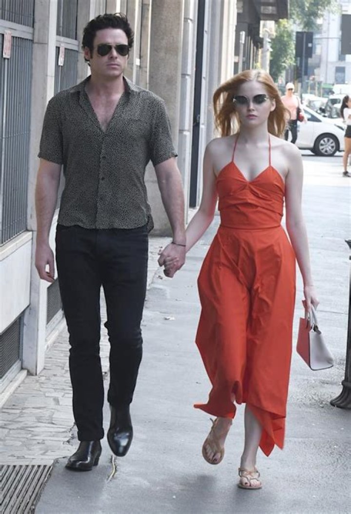 Ellie Bamber and Richard Madden walk hand in hand during Milan Fashion Week