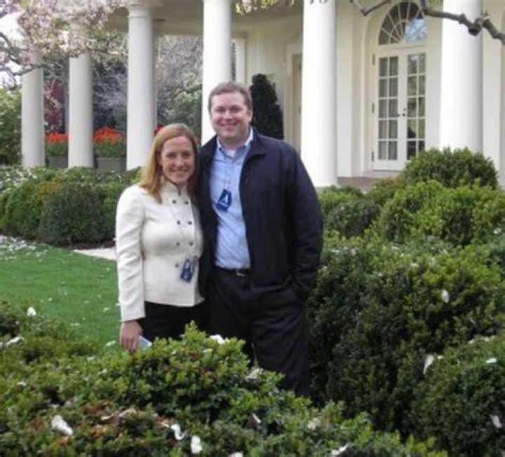 Gregory Mecher and his wife Jen Psaki in a frame.