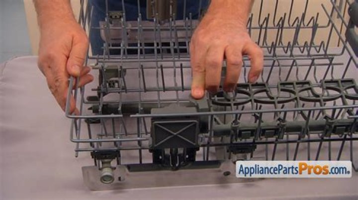 How do you adjust the upper rack on a Whirlpool dishwasher?