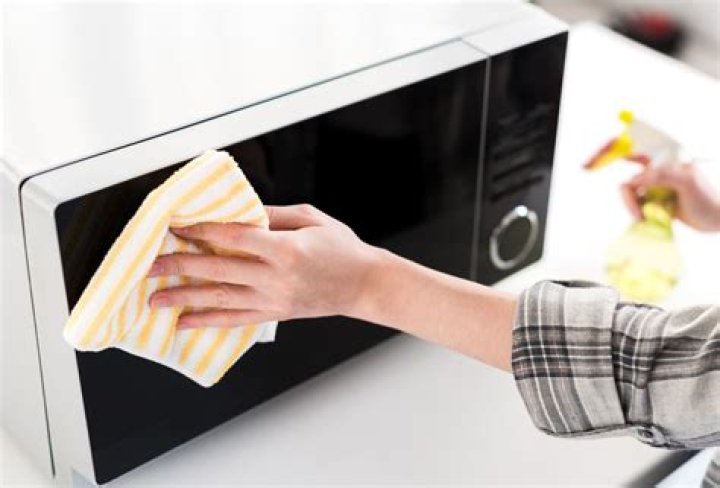 How do you remove grease from outside of microwave?