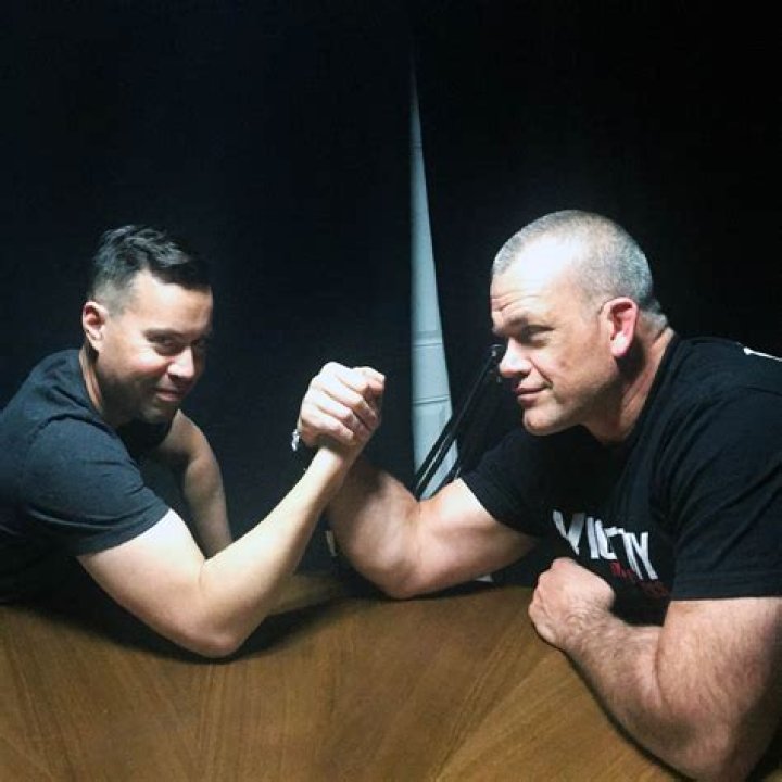 Jocko Willink is in his uniform, while his daughters Freja, Rana, and other daughter is standing between him and Helen Willink.