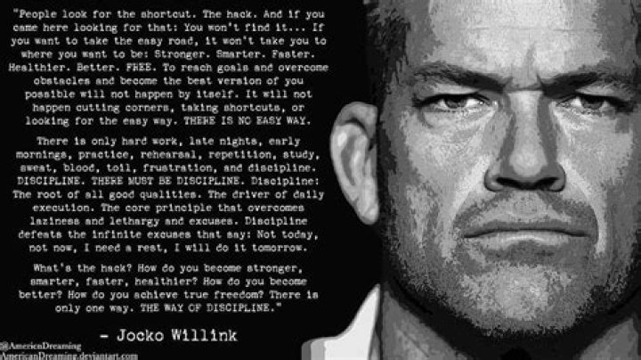 Jocko Willink is on a tuxedo with Navy badge and Hellen is wearing a black dress.