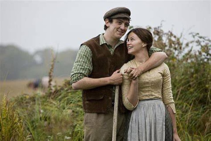 John Dalgleish with his girlfriend Aimie Atkinson hugging each other in a smiley face 