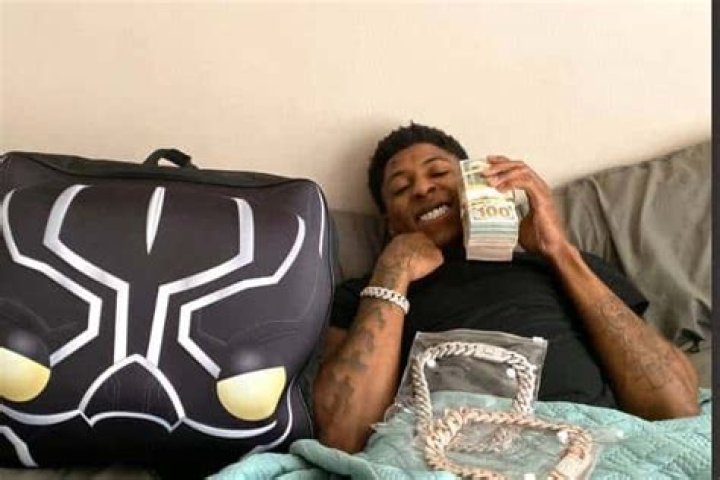 NBA YoungBoy, flaunting riches on his Twitter.