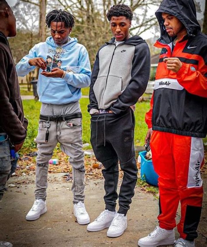 NBA YoungBoy, standing next to his car, Mclaren 570S.