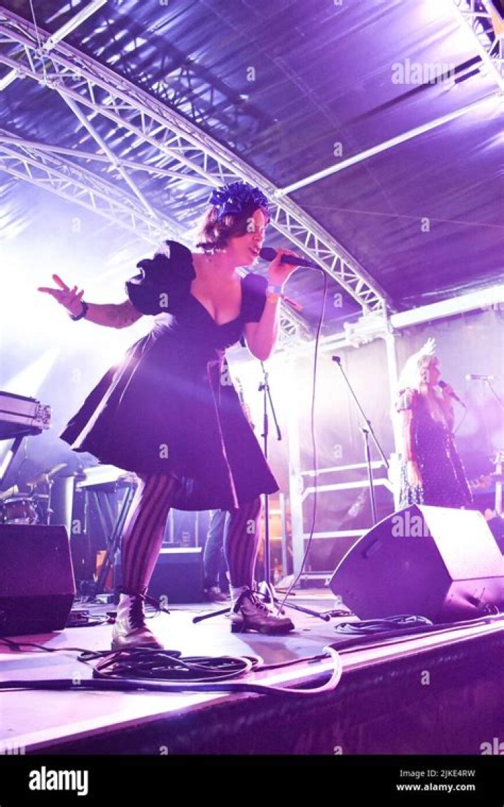 performing live on stage in front of his fans.
