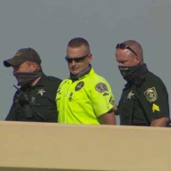 Police arresting Jeremy Dewitte.