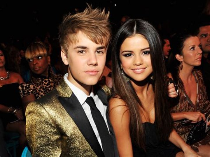 Selena Gomez and Justin Bieber arrive at the 2011 American Music Awards held at Nokia Theatre L.A. LIVE on November 20, 2011 in Los Angeles, Califo...