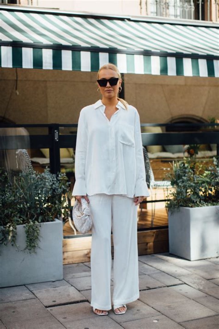 She is wearing all white in the picture.
