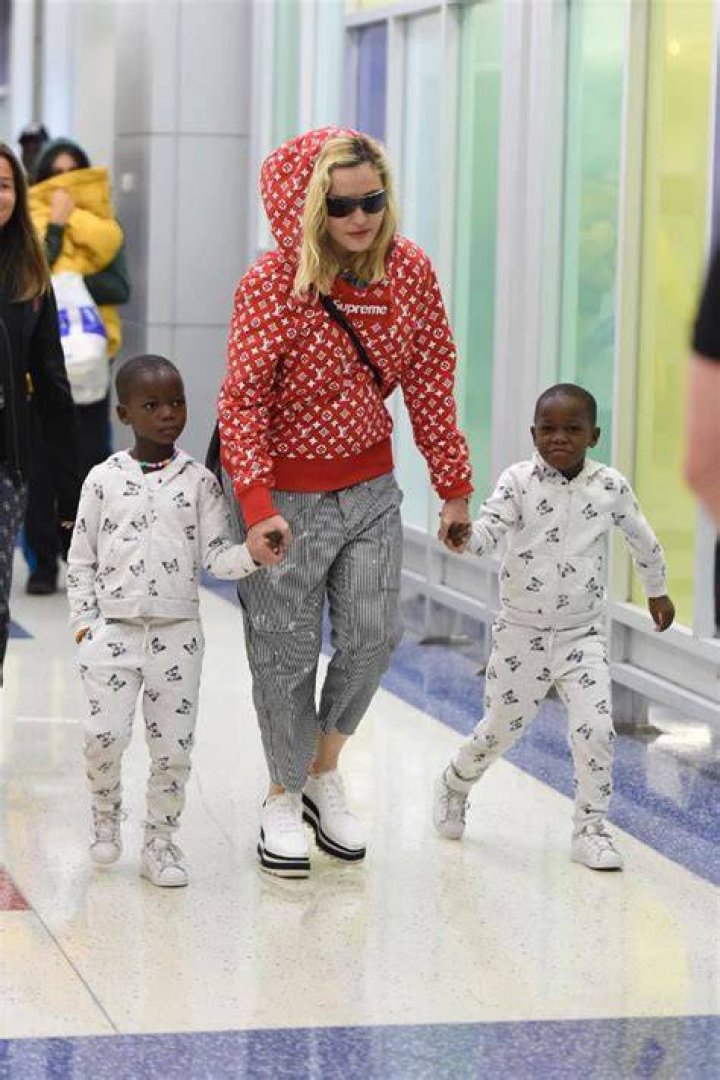 Stella and Estere Ciccone are wearing matching light blue colored outfits and a matching cap.