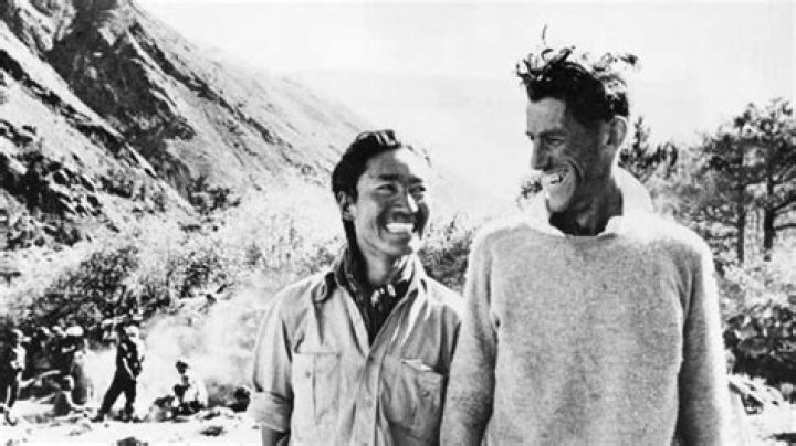 Tenzing Norgay Trainor sticking his blue-colored tongue out with a friend.