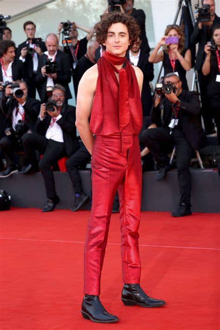 Timoth&eacute;e Chalamet pose for photos with a wrestling mask during the red carpet for the movie 'Dune: Part Two' at Auditorio Nacional on February 6, 2...