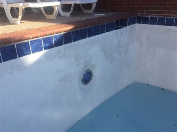 What is mottling of pool plaster?
