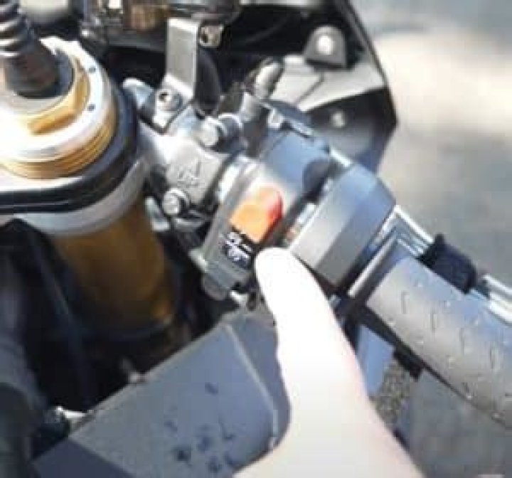 Why is my motorcycle throttle sticking?